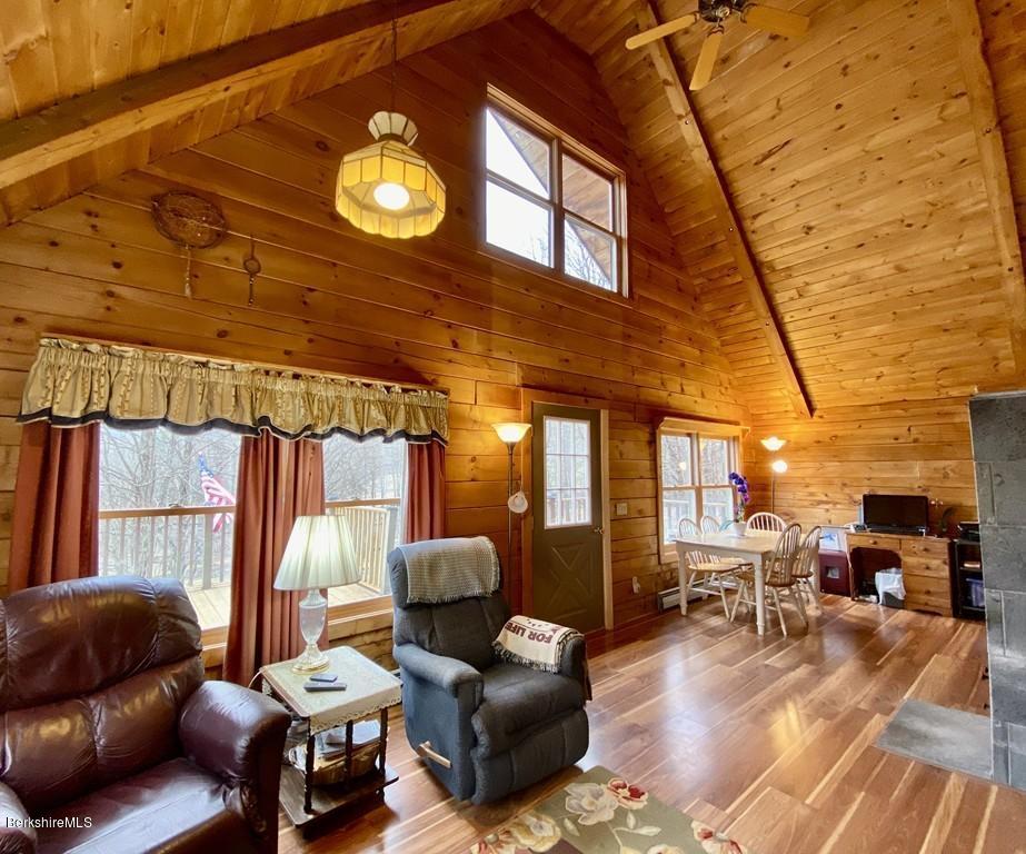 30 Avery Road Buckland, MA 01339 - Photo 3 of 26 a living room with furniture and a chandelier