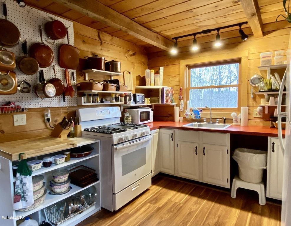 30 Avery Road Buckland, MA 01339 - Photo 9 of 26 a kitchen with a stove and cabinets