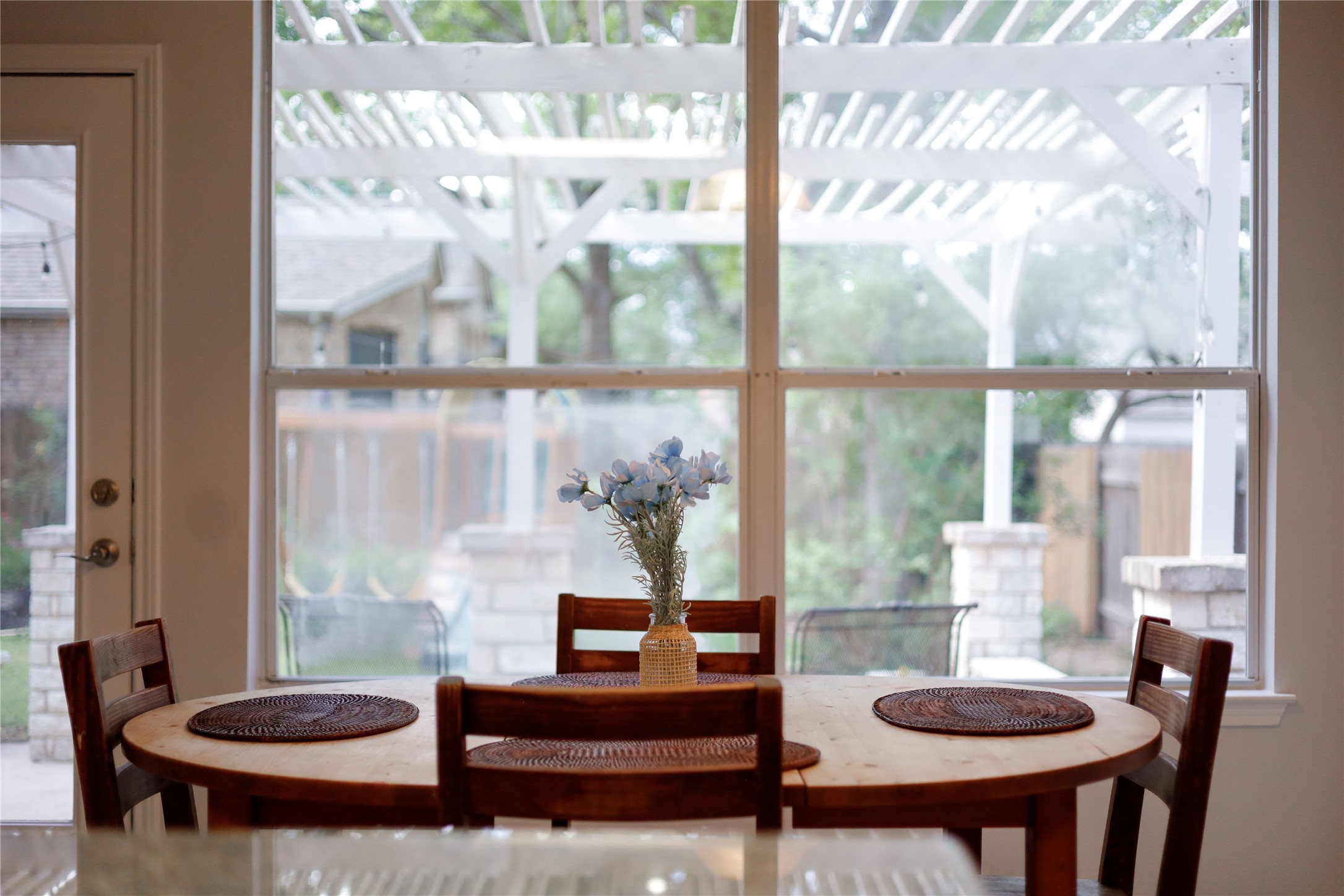 225 Trophy Pass Austin, TX 78748 - Photo 17 of 30 Large windows make the breakfas nook feel connected to the outdoor space, bringing in soft natural light and a peaceful backyard backdrop.