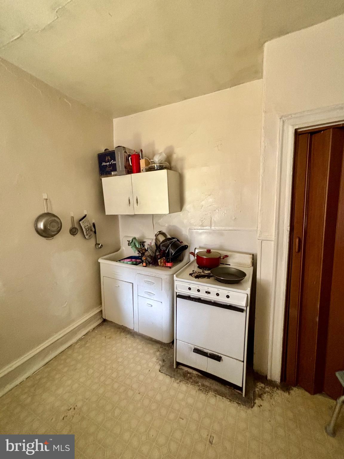 134 North Ruby Street Philadelphia, PA 19139 - Photo 19 of 34 a kitchen with stainless steel appliances a stove a sink and a refrigerator