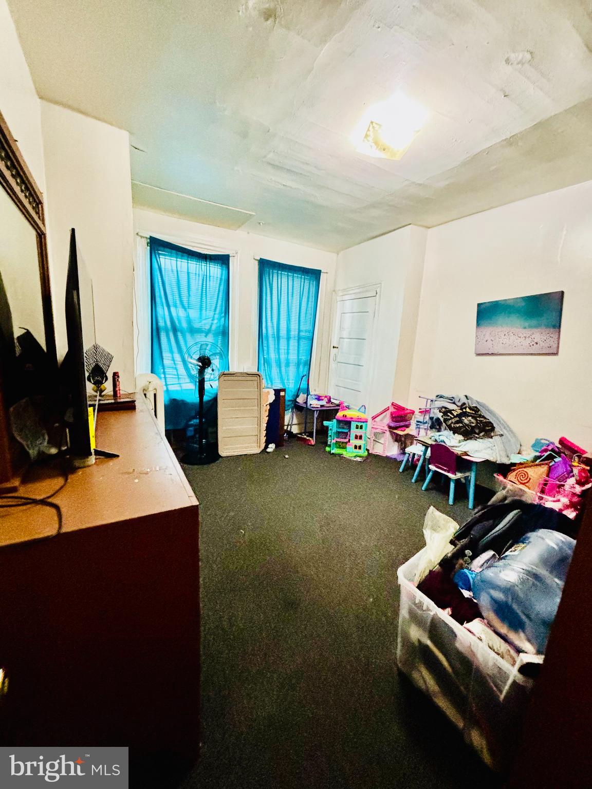 134 North Ruby Street Philadelphia, PA 19139 - Photo 25 of 34 a room with furniture and a flat screen tv