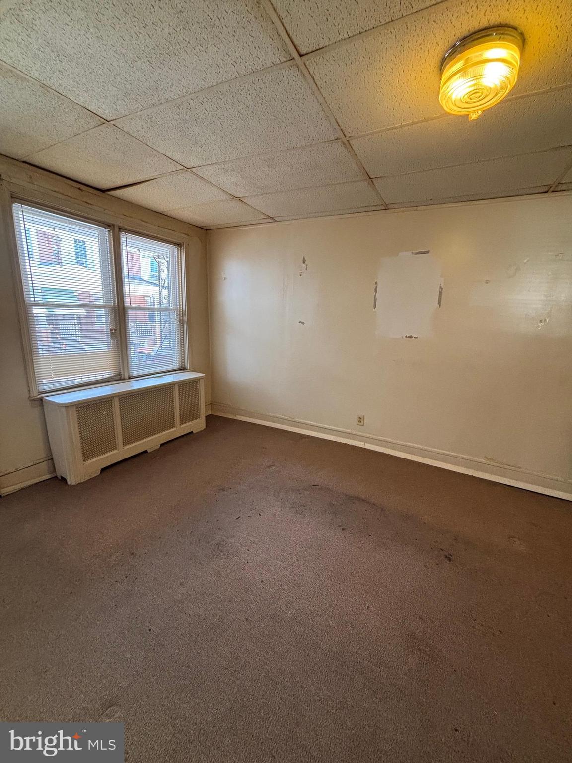 134 North Ruby Street Philadelphia, PA 19139 - Photo 6 of 34 an empty room with windows