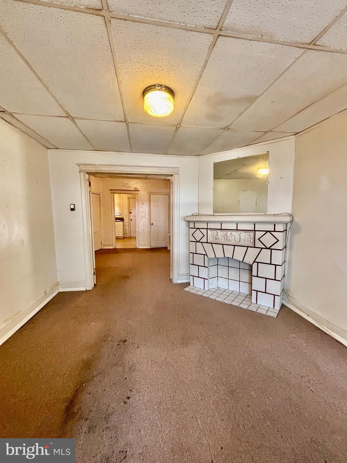 134 North Ruby Street Philadelphia, PA 19139 - Photo 8 of 34 a view of an empty room with a fireplace