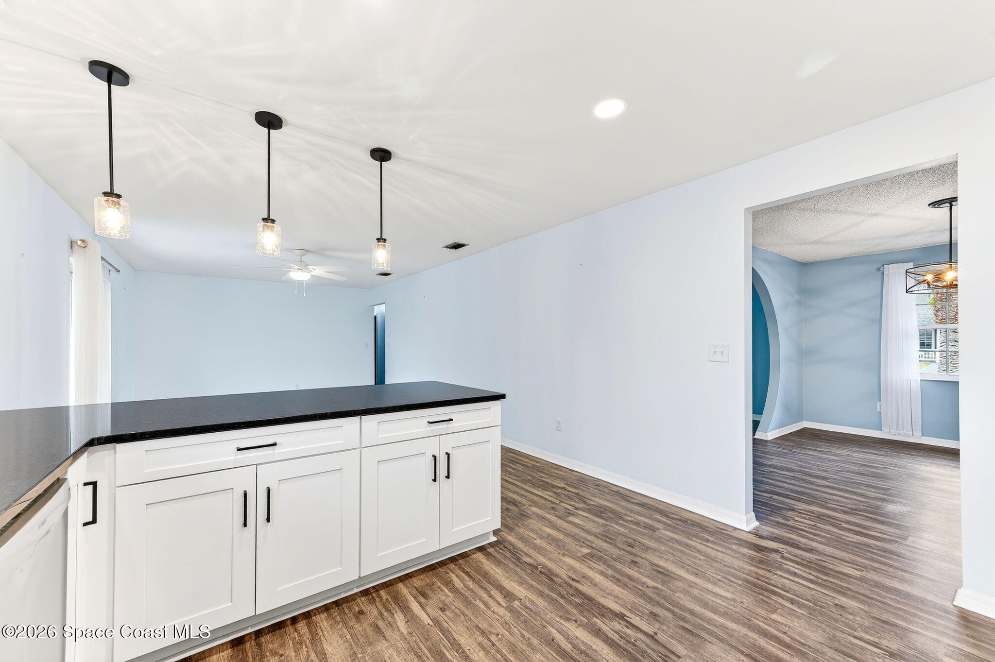 990 Boxford Lane Rockledge, FL 32955 - Photo 14 of 41 a kitchen with sink cabinets and wooden floor