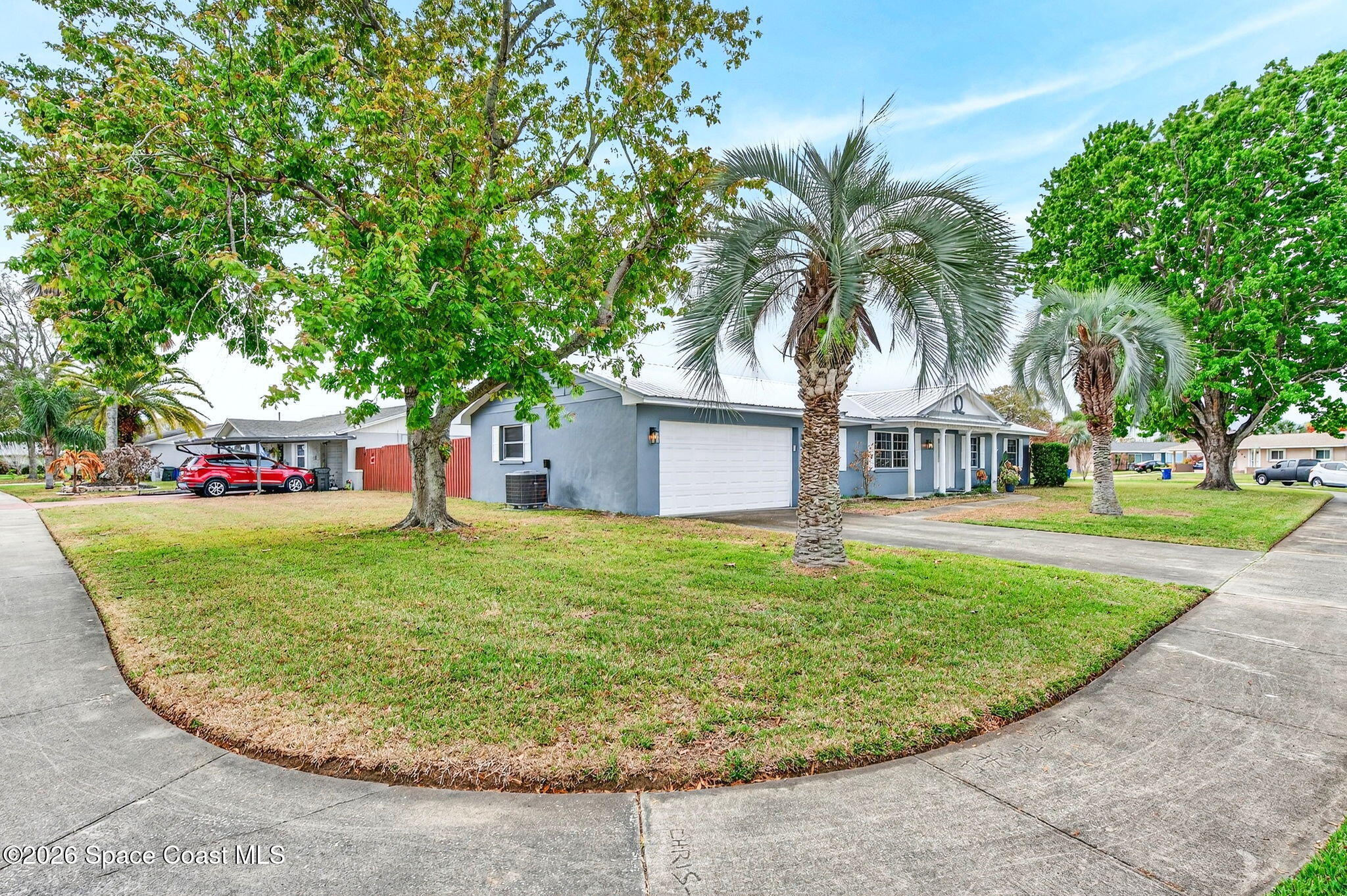 990 Boxford Lane Rockledge, FL 32955 - Photo 2 of 41 a front view of a house with garden