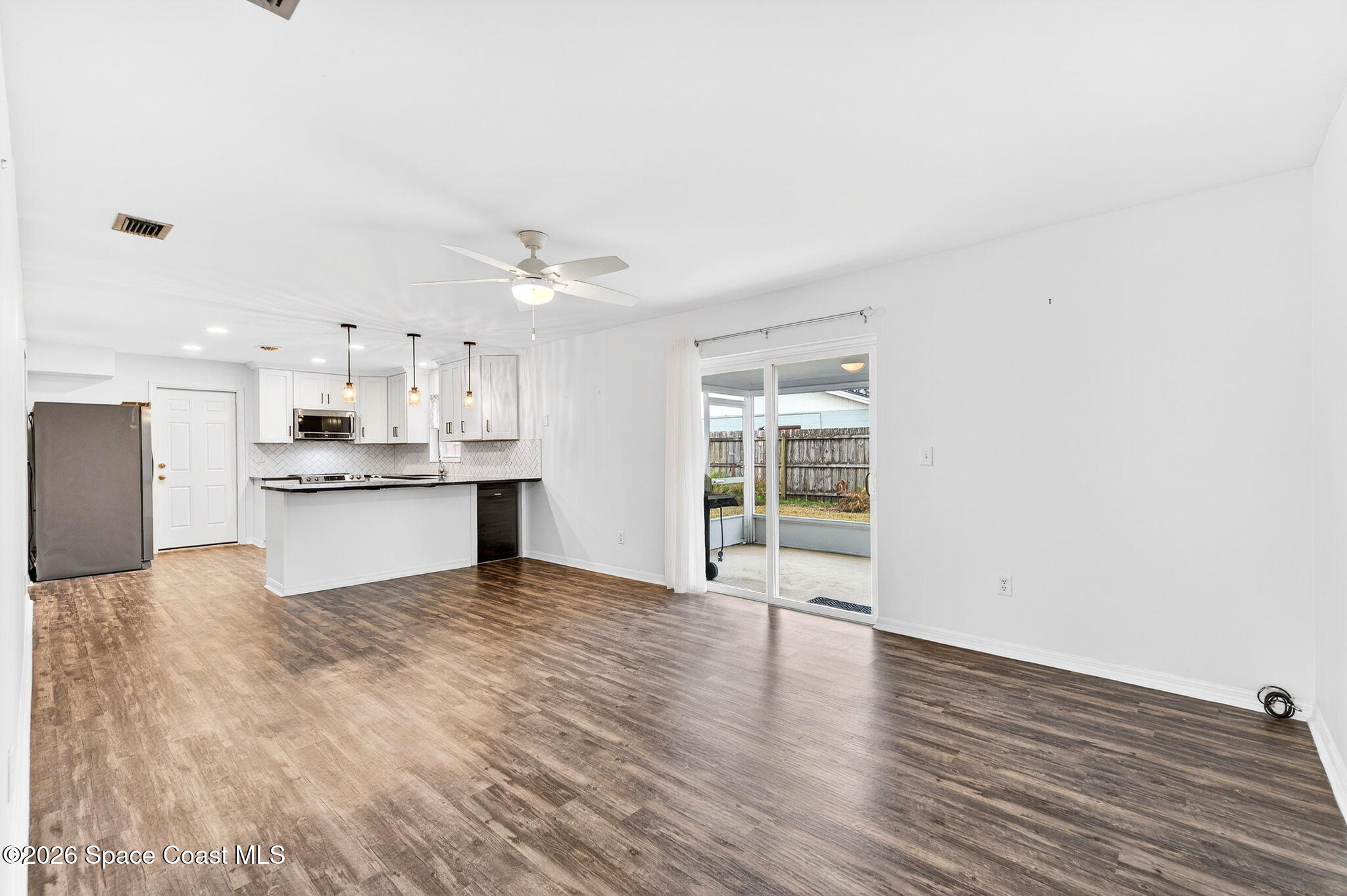 990 Boxford Lane Rockledge, FL 32955 - Photo 21 of 41 a view of kitchen with granite countertop cabinets and refrigerator