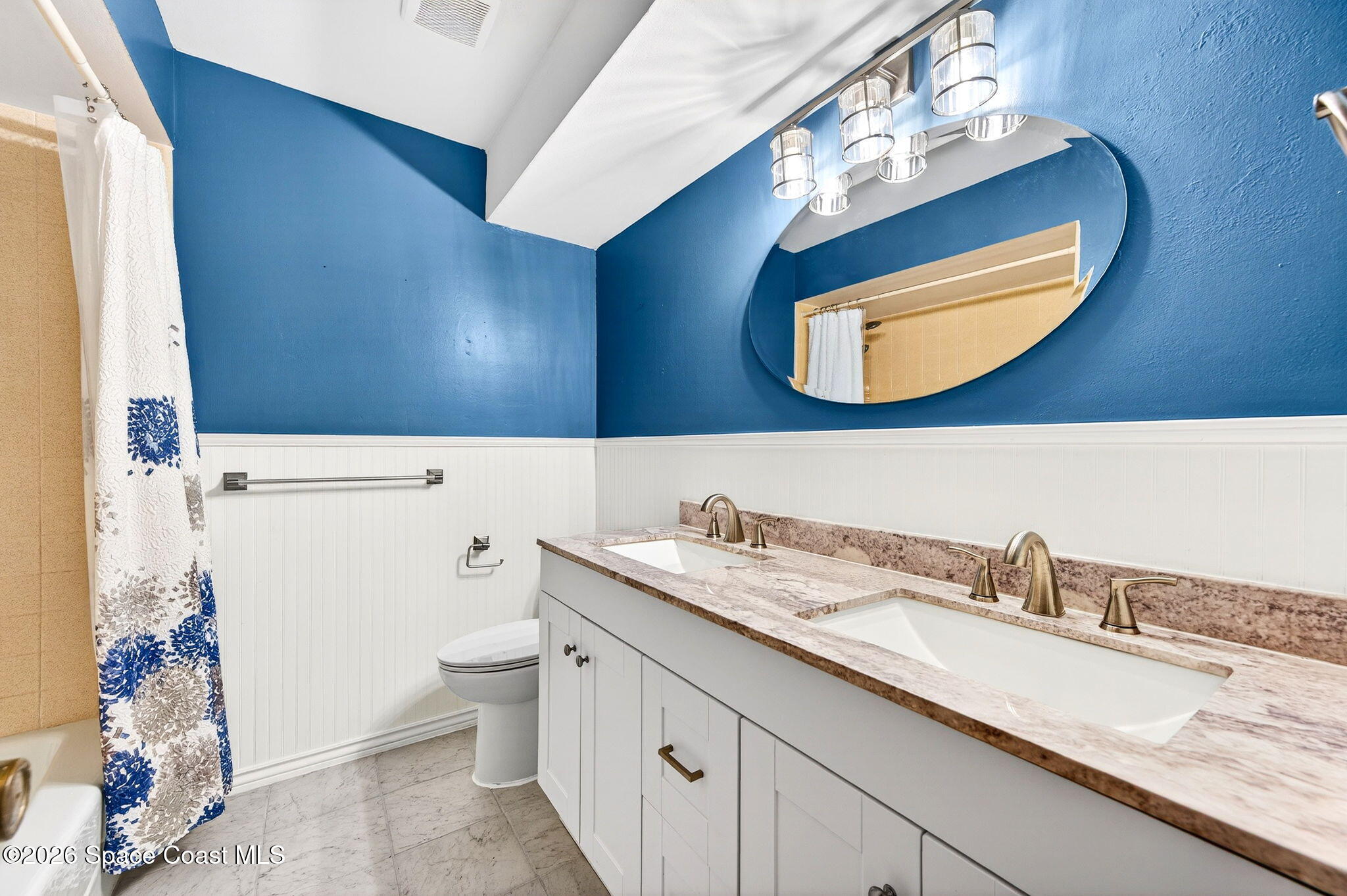 990 Boxford Lane Rockledge, FL 32955 - Photo 24 of 41 a bathroom with a sink a toilet and mirror