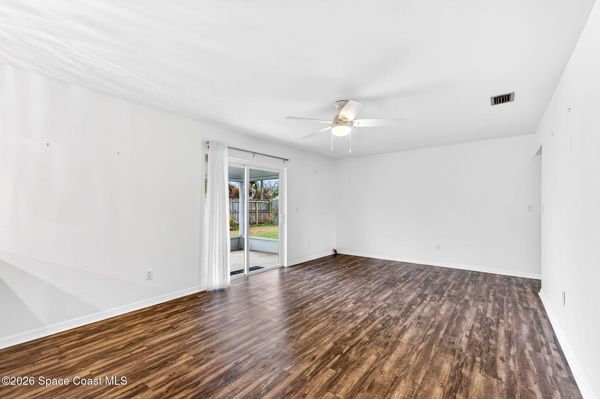 990 Boxford Lane Rockledge, FL 32955 - Photo 32 of 41 wooden floor in an empty room