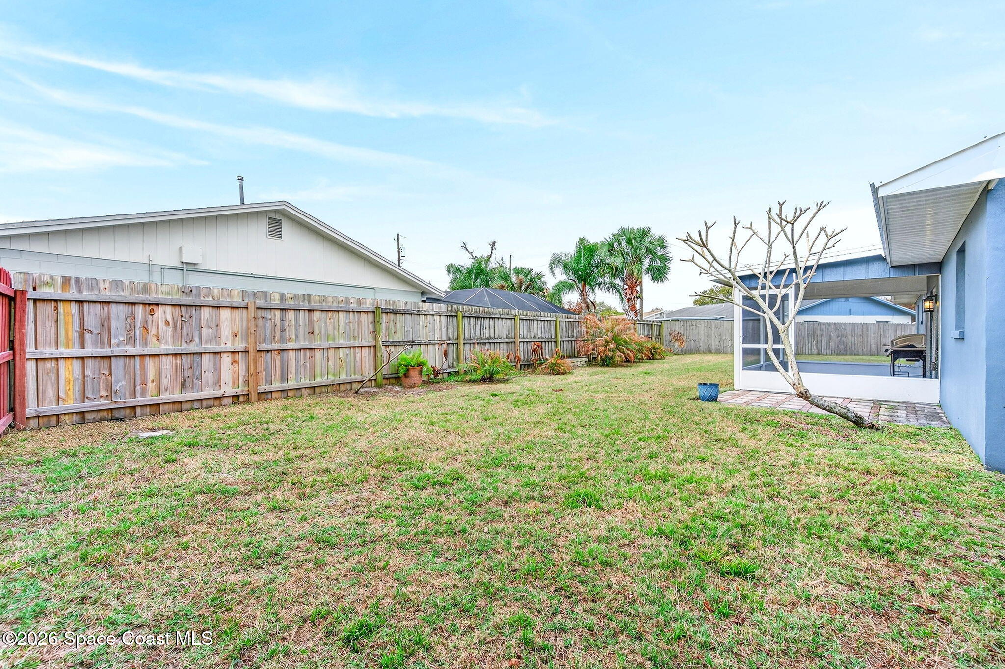 990 Boxford Lane Rockledge, FL 32955 - Photo 35 of 41 a view of a backyard with a garden and plants