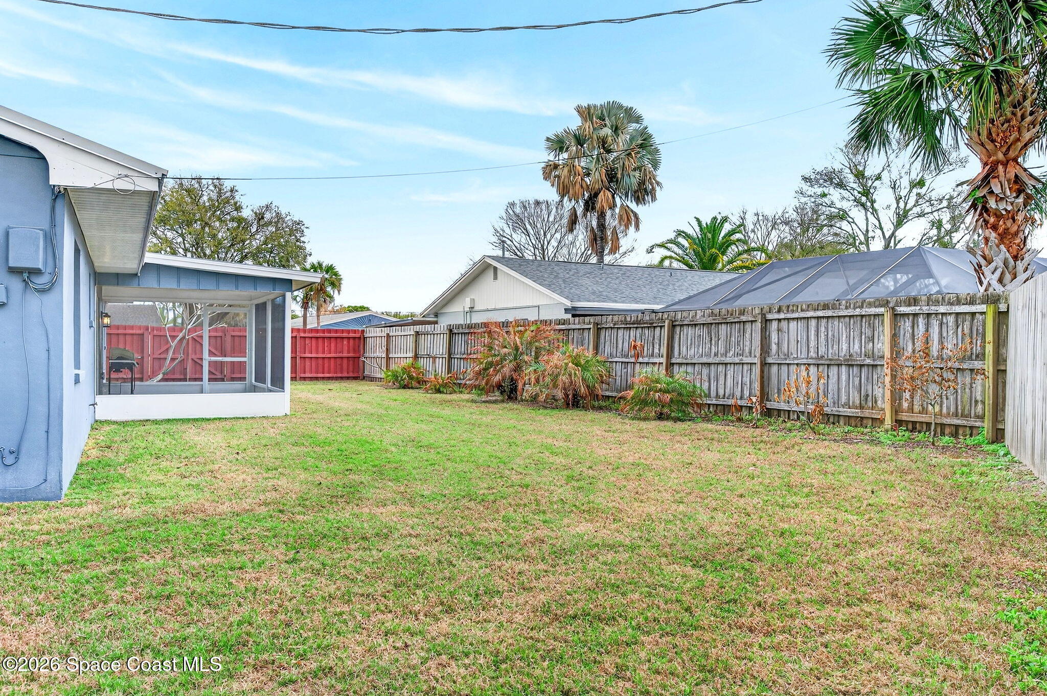 990 Boxford Lane Rockledge, FL 32955 - Photo 37 of 41 a view of a house with a yard and potted plants
