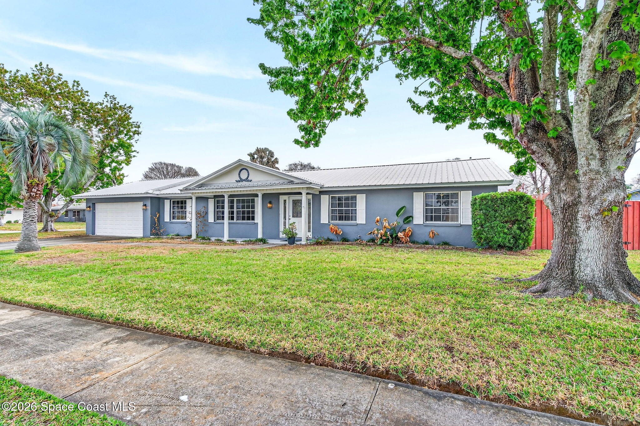 990 Boxford Lane Rockledge, FL 32955 - Photo 39 of 41 a front view of a house with a garden