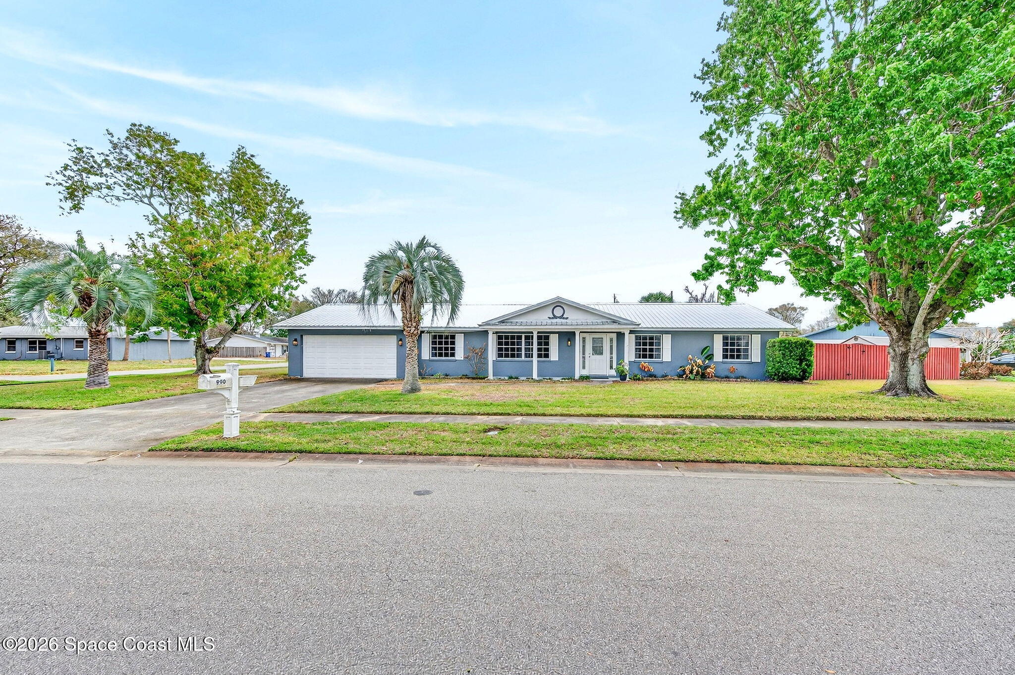 990 Boxford Lane Rockledge, FL 32955 - Photo 41 of 41 a front view of a house with a yard and trees