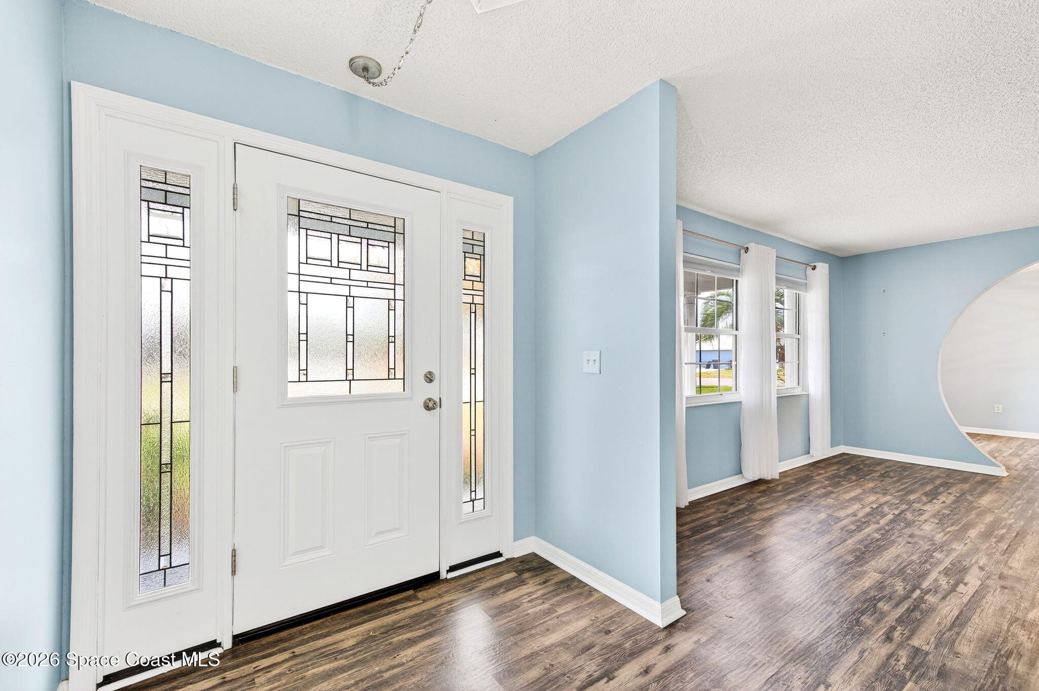990 Boxford Lane Rockledge, FL 32955 - Photo 5 of 41 a view of a room with wooden floor and windows
