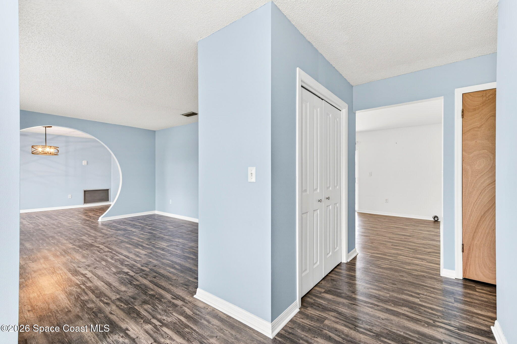 990 Boxford Lane Rockledge, FL 32955 - Photo 6 of 41 a view of kitchen and hallway with wooden floor