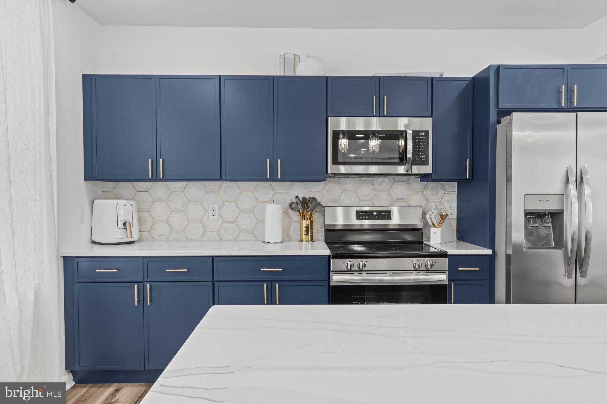 5320 Wynnefield Avenue Philadelphia, PA 19131 - Photo 11 of 33 a kitchen with a refrigerator stove and microwave