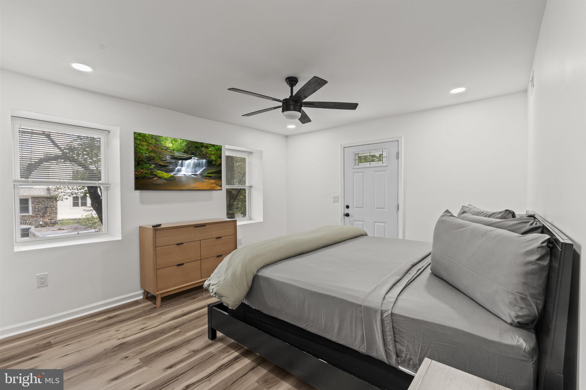 5320 Wynnefield Avenue Philadelphia, PA 19131 - Photo 15 of 33 a bedroom with a bed and a flat screen tv