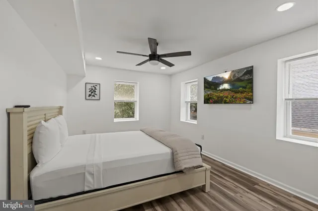 a bedroom with a bed and a couch