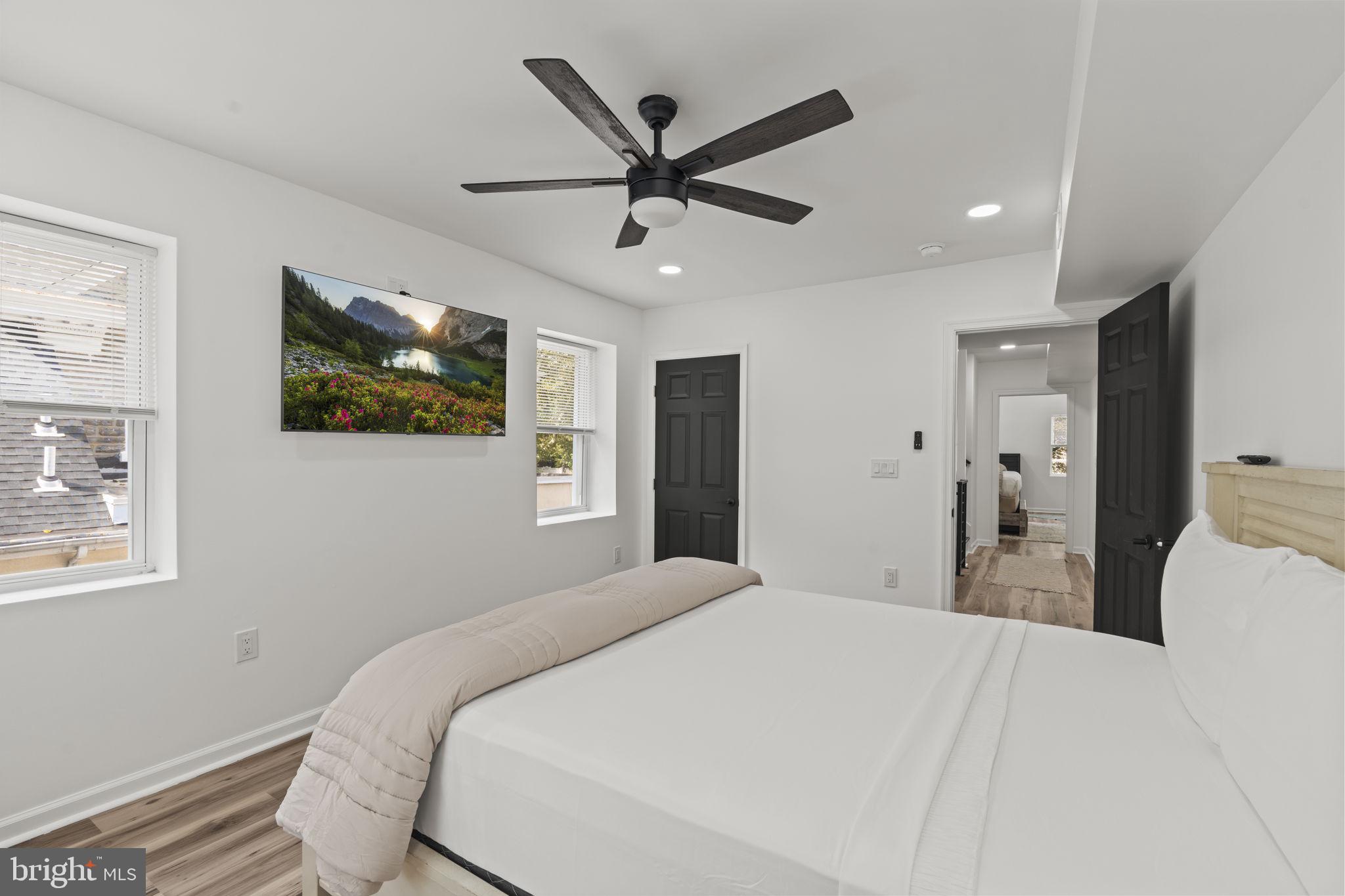 5320 Wynnefield Avenue Philadelphia, PA 19131 - Photo 20 of 33 a bedroom with a large bed and a ceiling fan