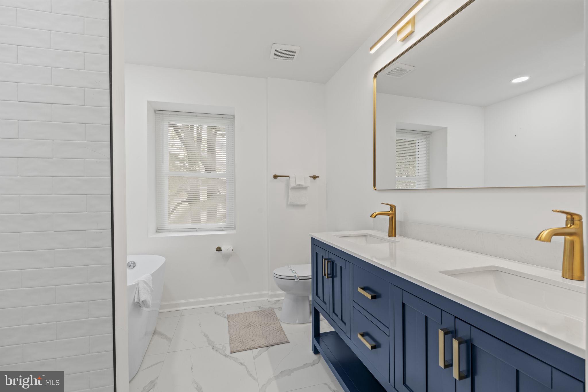 5320 Wynnefield Avenue Philadelphia, PA 19131 - Photo 22 of 33 a bathroom with a sink a toilet and shower