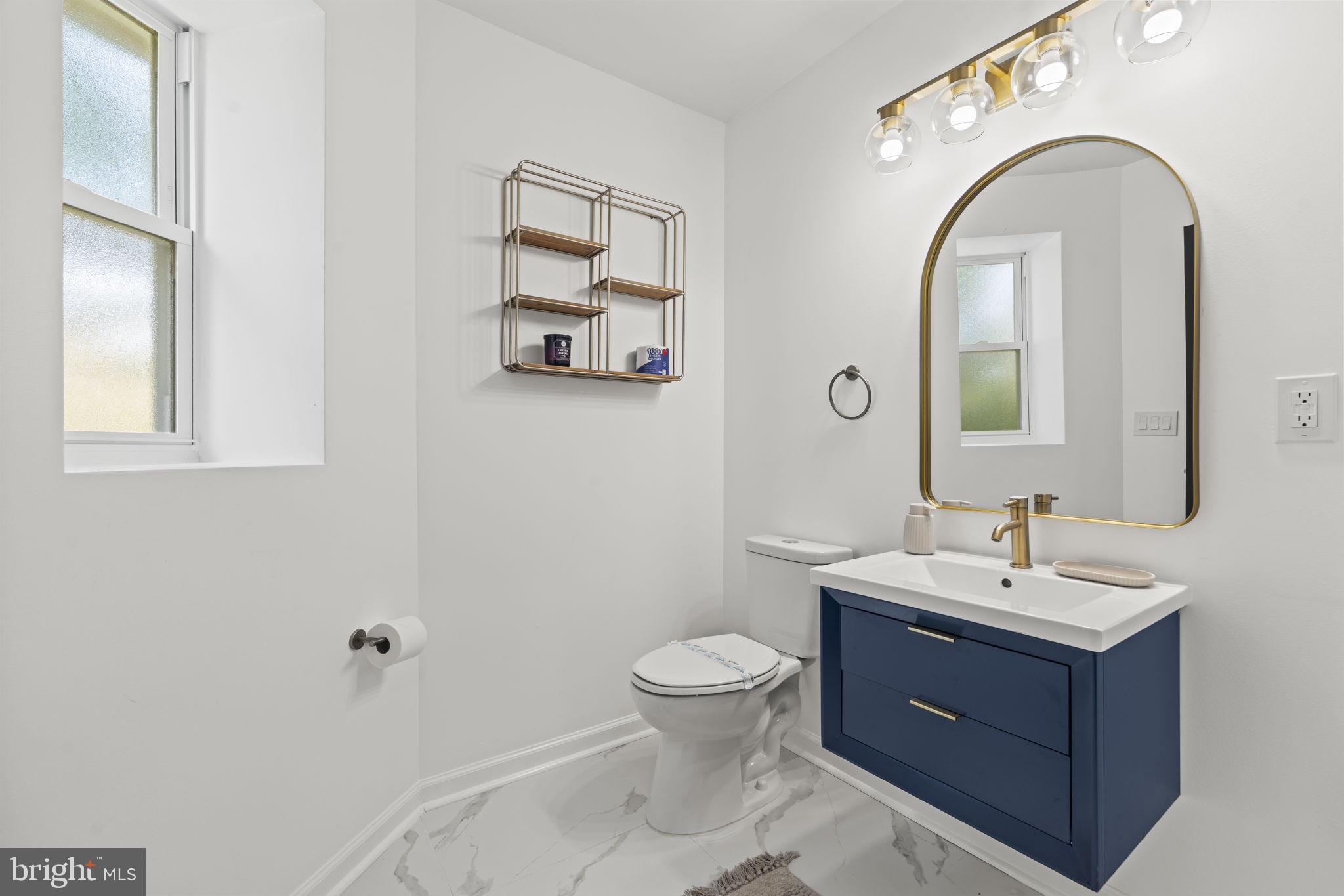 5320 Wynnefield Avenue Philadelphia, PA 19131 - Photo 27 of 33 a bathroom with a toilet sink and mirror