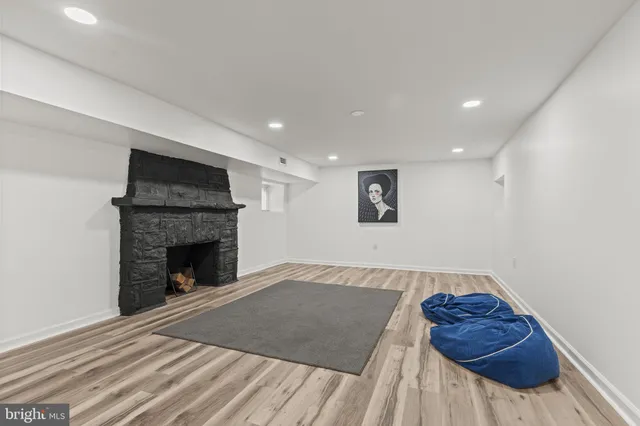 a view of livingroom with furniture and a fireplace