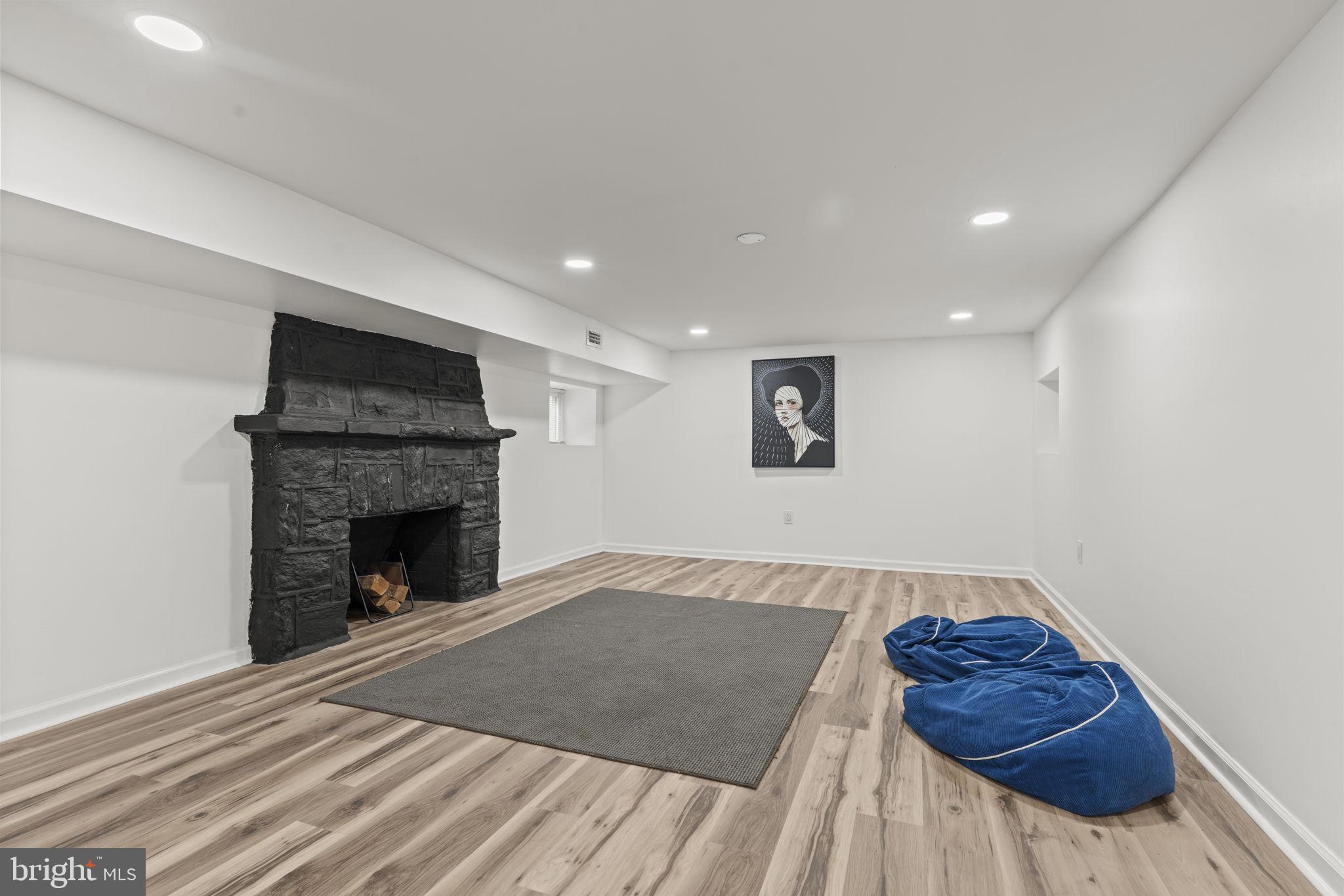 5320 Wynnefield Avenue Philadelphia, PA 19131 - Photo 32 of 33 a view of livingroom with furniture and a fireplace