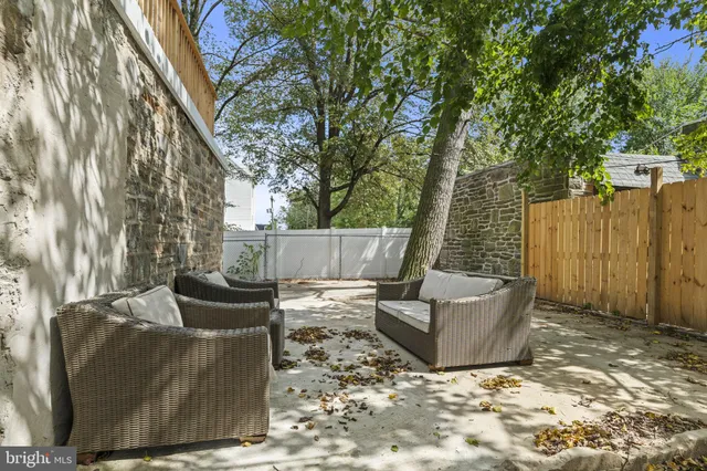 a backyard of a house with seating space