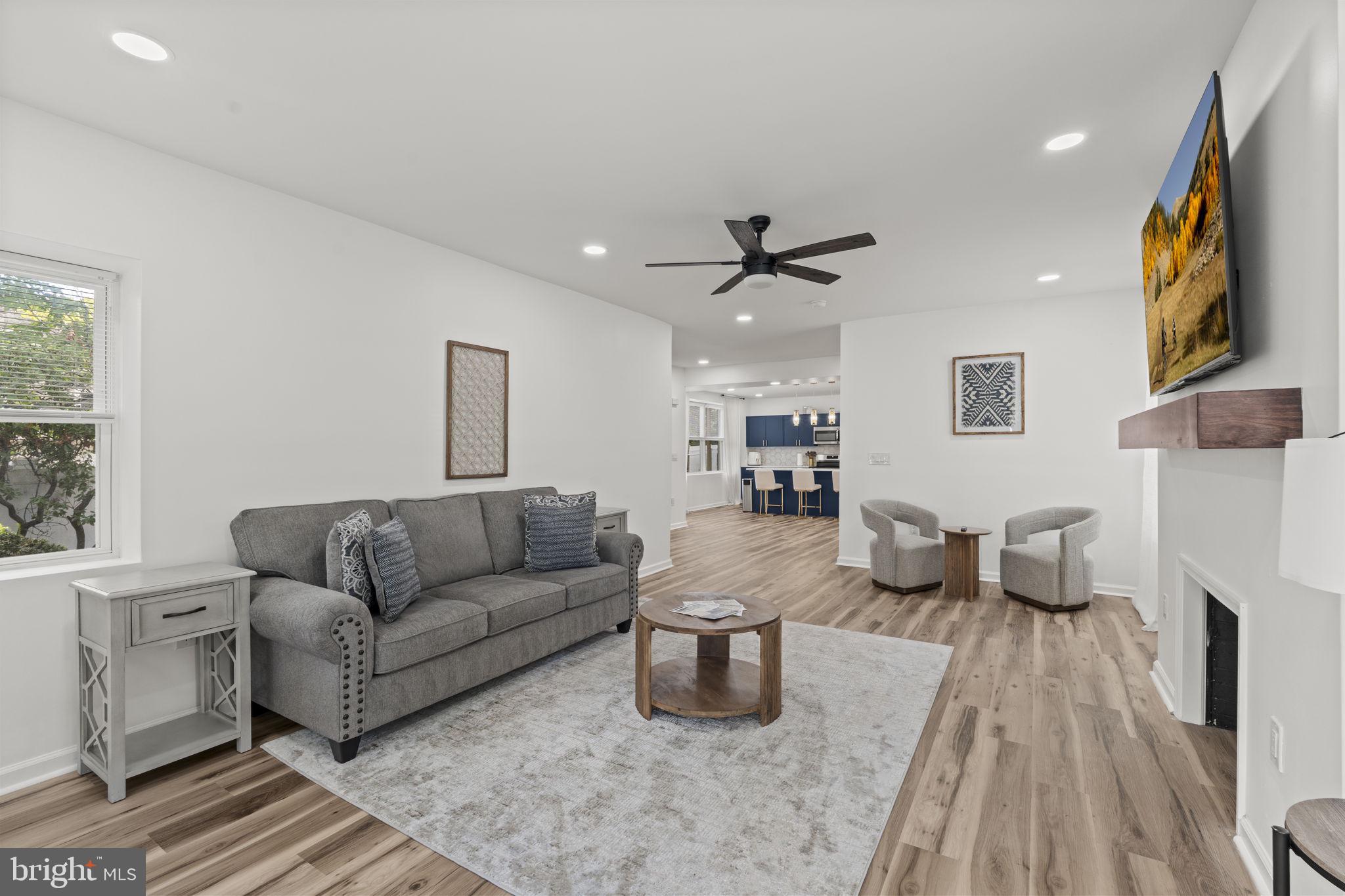 5320 Wynnefield Avenue Philadelphia, PA 19131 - Photo 4 of 33 a living room with furniture and a fireplace