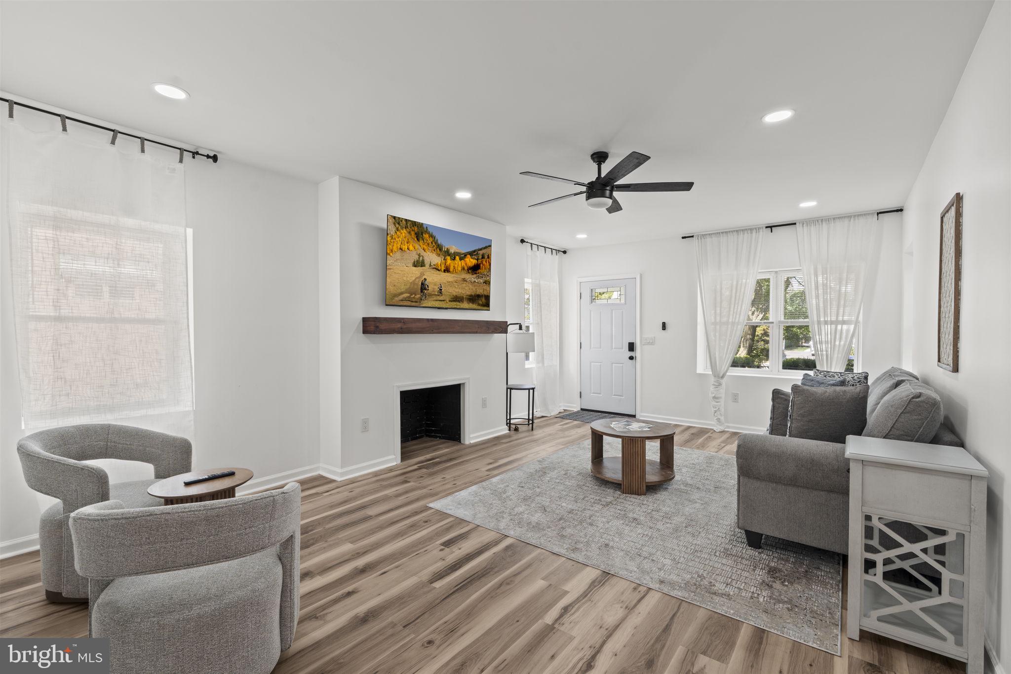 5320 Wynnefield Avenue Philadelphia, PA 19131 - Photo 6 of 33 a living room with furniture and a fireplace