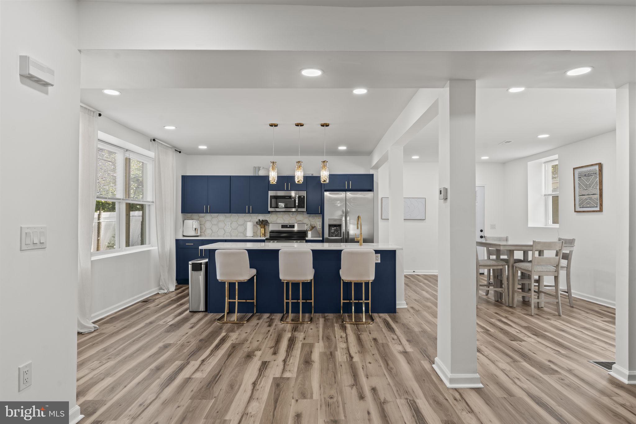 5320 Wynnefield Avenue Philadelphia, PA 19131 - Photo 8 of 33 a large kitchen with a table and chairs