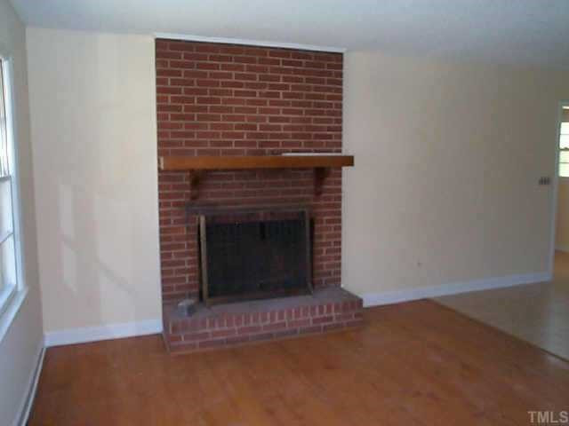 9737 Fairchild Road Zebulon, NC 27597 - Photo 5 of 5 VIEW OF LIVING ROOM WITH FIREPLACE AND HARDWOOD FLOORS Other