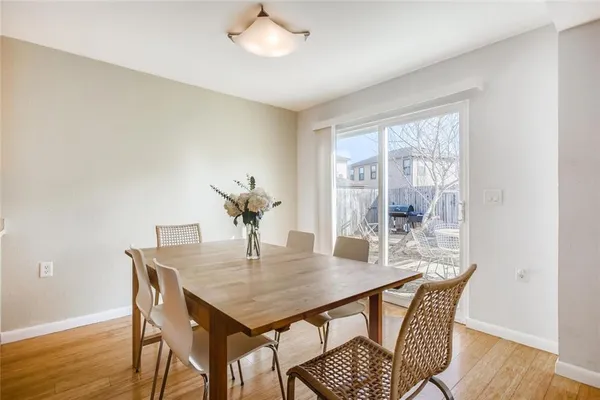 a living room with furniture a flat screen tv and a table