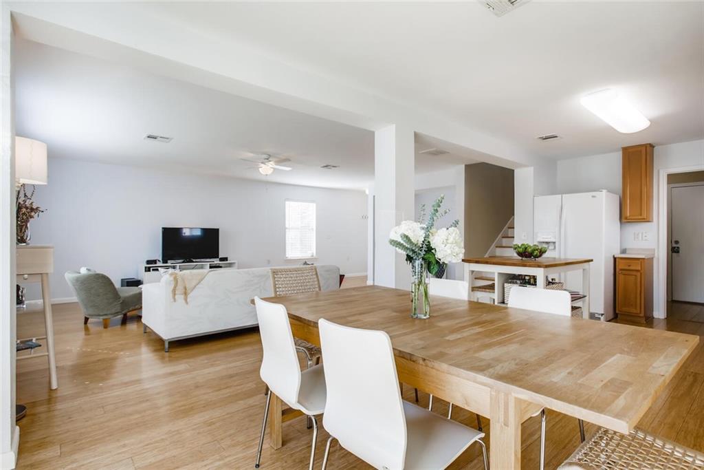 8813 Winter Haven Road Austin, TX 78747 - Photo 16 of 28 a living room with furniture a flat screen tv and a table