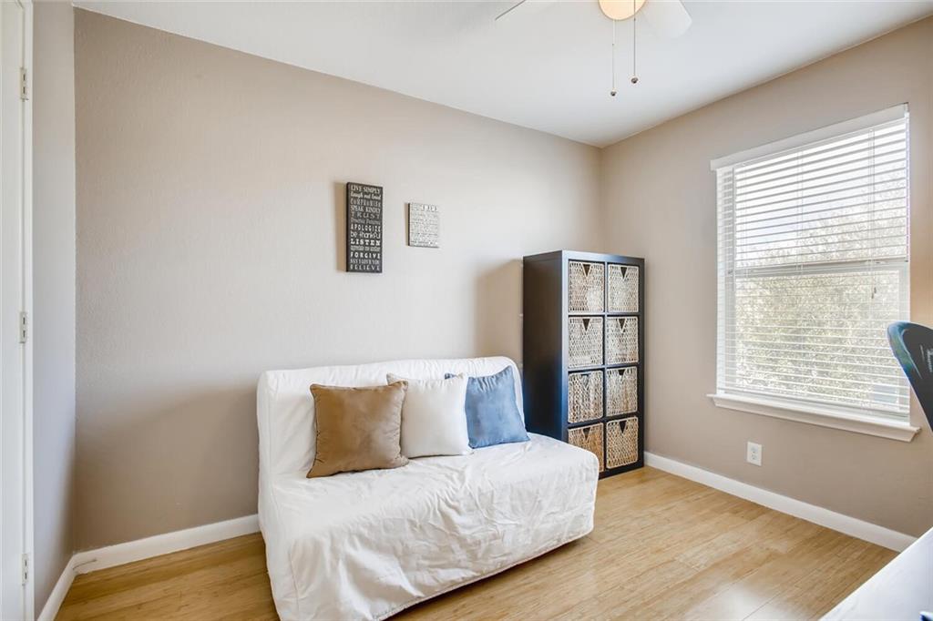 8813 Winter Haven Road Austin, TX 78747 - Photo 20 of 28 a bedroom with a bed and a window