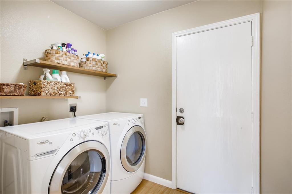 8813 Winter Haven Road Austin, TX 78747 - Photo 23 of 28 a utility room with dryer and washer
