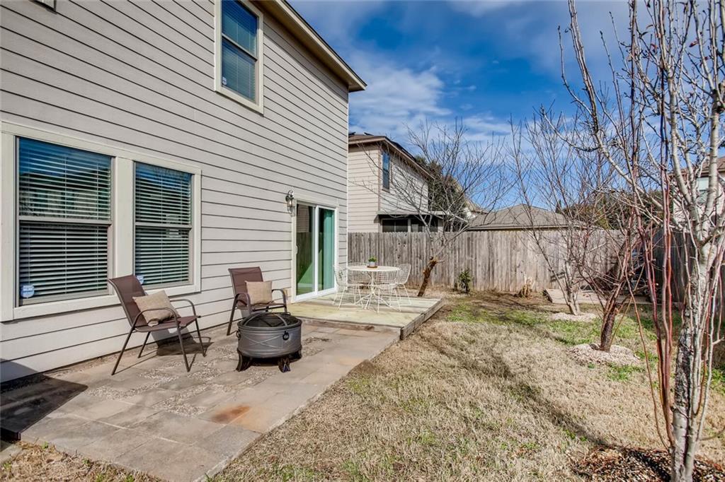 8813 Winter Haven Road Austin, TX 78747 - Photo 24 of 28 a view of backyard with a patio and outdoor seating