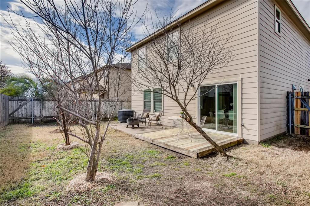 8813 Winter Haven Road Austin, TX 78747 - Photo 25 of 28 a view of a house with backyard and wooden fence