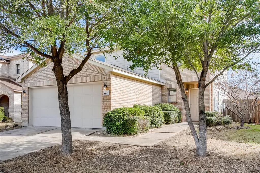 8813 Winter Haven Road Austin, TX 78747 - Photo 9 of 28 a house with a tree in front of it
