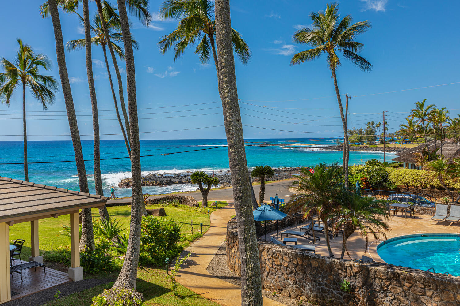 1870 Hoone Road, Unit 200 Koloa, HI 96756 - Photo 1 of 23 a view of swimming pool with outdoor seating and plants