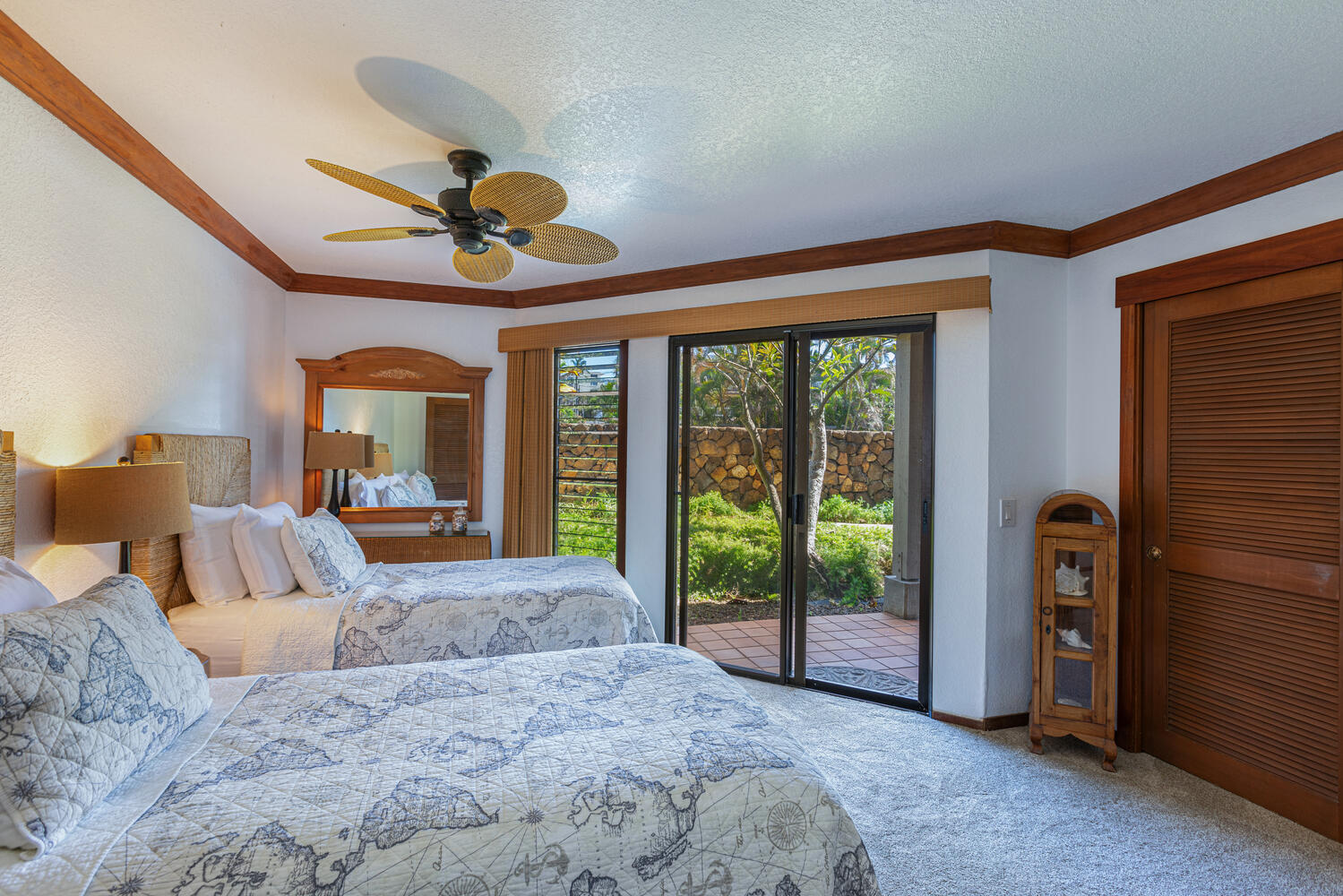 1870 Hoone Road, Unit 200 Koloa, HI 96756 - Photo 16 of 23 a bed room with a bed and a chandelier