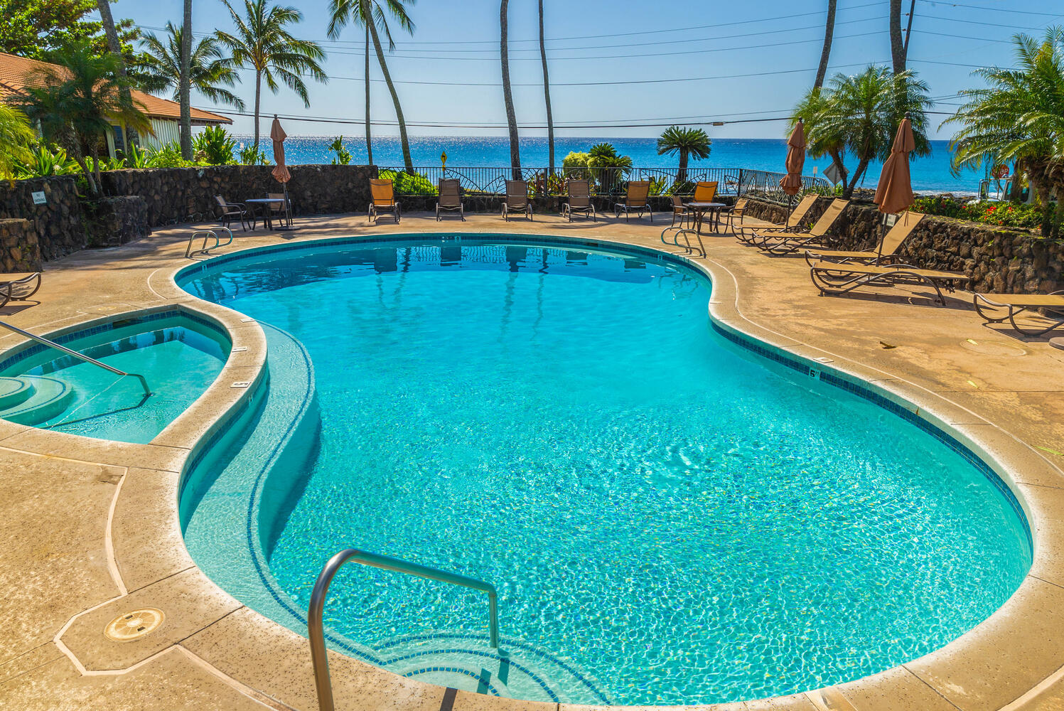 1870 Hoone Road, Unit 200 Koloa, HI 96756 - Photo 19 of 23 a view of a swimming pool with outdoor seating and yard