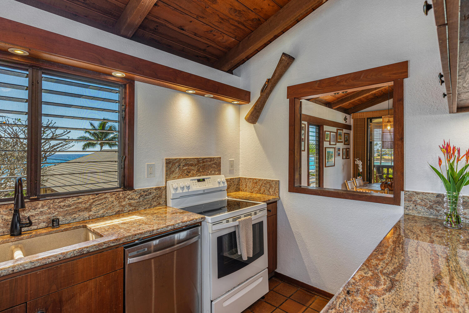 1870 Hoone Road, Unit 200 Koloa, HI 96756 - Photo 7 of 23 a kitchen that has a sink and a stove