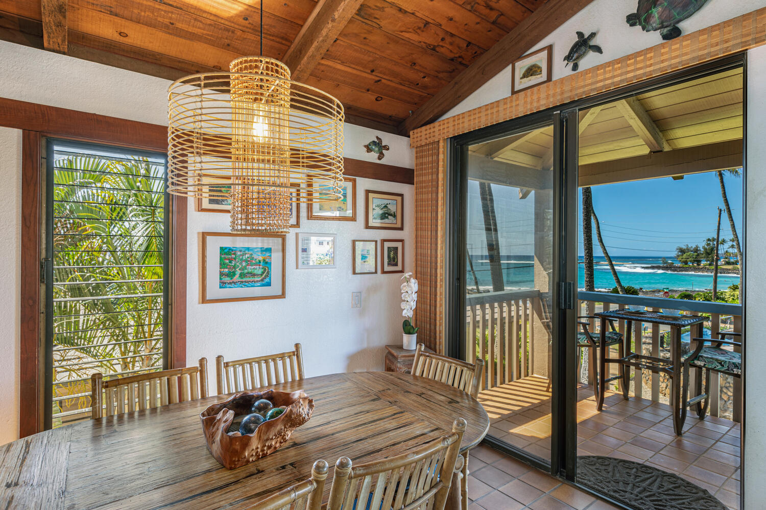 1870 Hoone Road, Unit 200 Koloa, HI 96756 - Photo 8 of 23 a bedroom with a bed and wooden floor