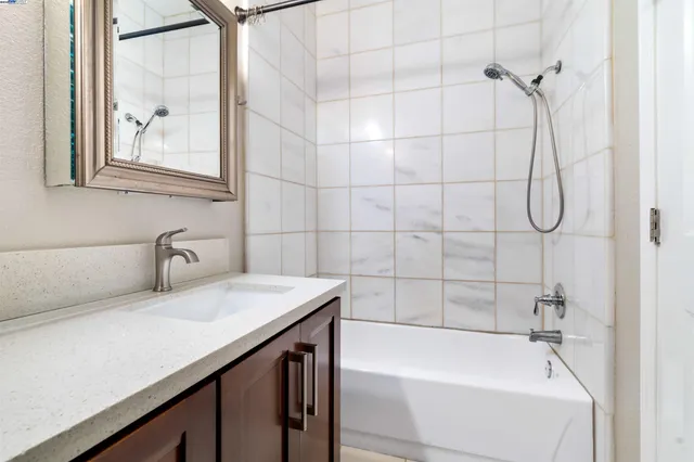 a utility room with sink dryer and washer