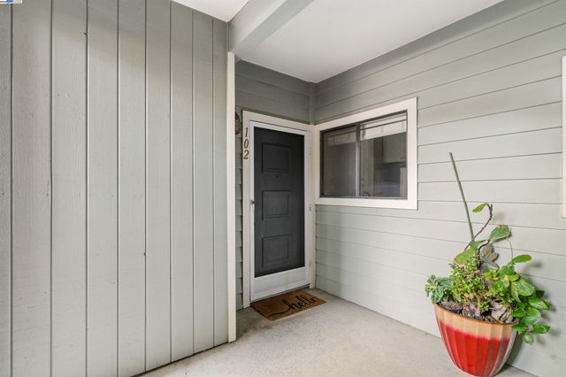 a living room with furniture a window and a fireplace