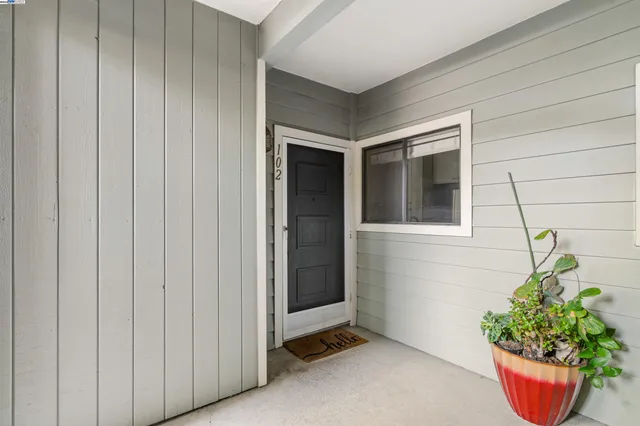 a living room with furniture a window and a fireplace
