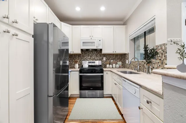 a bedroom with bed and a large window