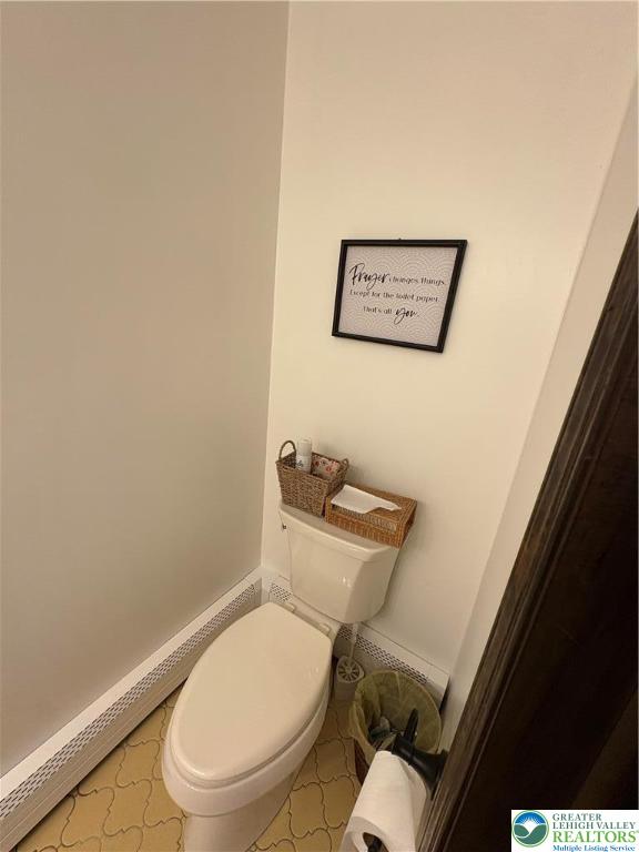 1020 East Main Street Weatherly, PA 18255 - Photo 14 of 28 a white toilet sitting next to a small bathroom