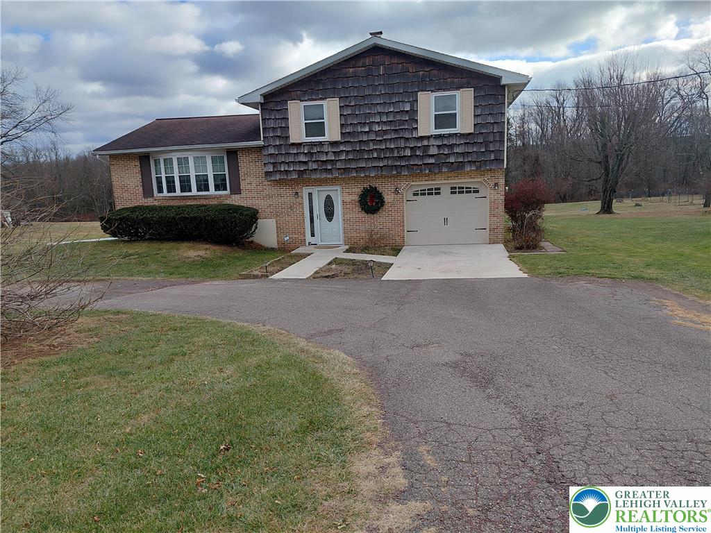 1020 East Main Street Weatherly, PA 18255 - Photo 3 of 28 a front view of a house with garden