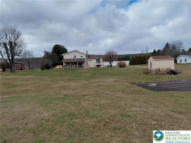 a living room with furniture and a lamp